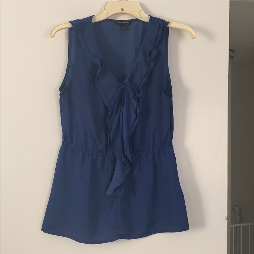 Blue ruffle sleeveless blouse